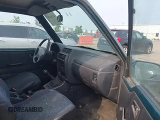 1997 Chevrolet Tracker z VIN 2CNBJ1863V6906951, wystawiony jako IAAI lot #42400087 z przebiegiem 209 563 mil mil oraz . Historia ofert i sprzedaży dostępna na DreamBid. Obrazek 5.