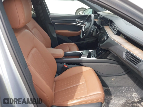2022 Audi e-tron Premium with VIN WA1AAAGE3NB033122, listed as a IAAI auction lot 42081343 with 36,171 mi miles and . Bid and sale history available at DreamBid. Image 5.