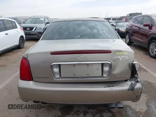 2003 Cadillac DeVille z VIN 1G6KD54Y63U223640, wystawiony jako IAAI lot #41704549 z przebiegiem 127 981 mil mil oraz . Historia ofert i sprzedaży dostępna na DreamBid. Obrazek 16.