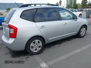 2009 Kia Rondo LX with VIN KNAFG528497222225, listed as a IAAI auction lot 42108192 with 113,040 mi miles. Bid and sale history available at carsss.com. Image 4.