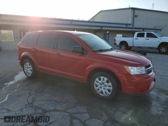 2015 Dodge Journey American Value with VIN 3C4PDCABXFT720583, listed as a Copart auction lot 52882515 with 173,575 mi miles and Salvage Title. Bid and sale history available at DreamBid. Image 4.