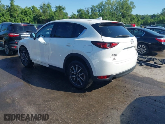 2018 Mazda CX-5 Grand Touring z VIN JM3KFBDM8J0420422, wystawiony jako IAAI lot #42188348 z przebiegiem 102 216 mil mil oraz . Historia ofert i sprzedaży dostępna na DreamBid. Obrazek 3.
