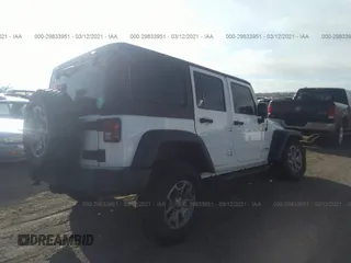 2013 Jeep Wrangler Unlimited Rubicon 10th Anniversary with VIN 1C4HJWFG0DL681417, listed as a IAAI auction lot 29833951 with 118,673 mi miles and . Bid and sale history available at DreamBid. Image 4.