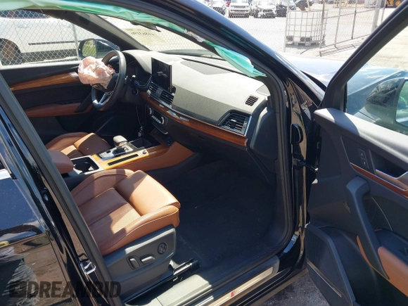 2023 Audi Q5 S line Premium Plus z VIN WA1EAAFY6P2168594, wystawiony jako IAAI lot #41863196 z przebiegiem 16 310 mil mil oraz . Historia ofert i sprzedaży dostępna na DreamBid. Obrazek 5.
