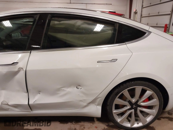 2018 Tesla Model 3 Long Range Battery with VIN 5YJ3E1EB5JF084446, listed as a IAAI auction lot 41209852 with 70,125 mi miles and . Bid and sale history available at DreamBid. Image 21.