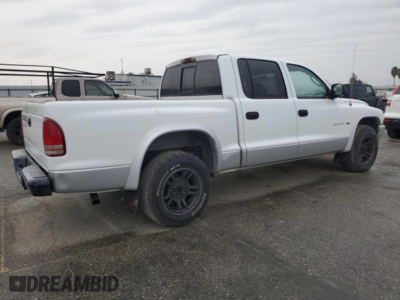 2002 Dodge Dakota SLT z VIN 1B7HL48N22S636413, wystawiony jako Copart lot #47884475 z przebiegiem 226 723 mil mil oraz Czysty tytuł • Clean title. Historia ofert i sprzedaży dostępna na DreamBid. Obrazek 3.