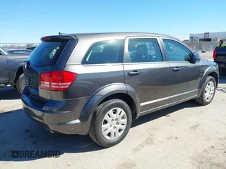2015 Dodge Journey SE z VIN 3C4PDCAB5FT739266, wystawiony jako IAAI lot #41725086 z przebiegiem 134 109 mil mil oraz . Historia ofert i sprzedaży dostępna na DreamBid. Obrazek 4.