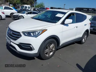 2017 Hyundai Santa Fe 2.4L z VIN 5XYZTDLB0HG403842, wystawiony jako IAAI lot #42206543 z przebiegiem 77 900 mil mil oraz . Historia ofert i sprzedaży dostępna na DreamBid. Obrazek 2.