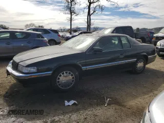 1993 Cadillac Eldorado z VIN 1G6EL1296PU617343, wystawiony jako Copart lot #47745985 z przebiegiem 84 713 mil mil oraz Czysty tytuł • Clean title. Historia ofert i sprzedaży dostępna na DreamBid. Obrazek 1.