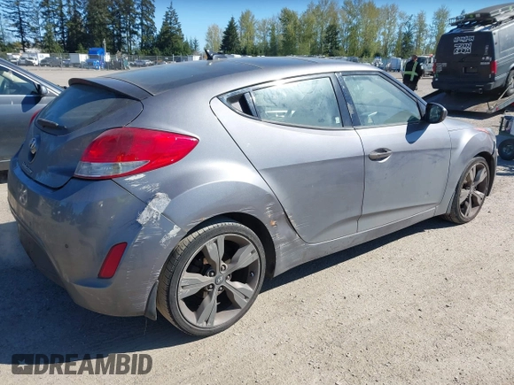 2013 Hyundai Veloster w/Black Int with VIN KMHTC6AD8DU103122, listed as a IAAI auction lot 42068175 with 123,512 mi miles and . Bid and sale history available at DreamBid. Image 4.