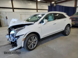 2025 Cadillac XT5 FWD Premium Luxury with VIN 1GYKNCRSXSZ106707, listed as a Copart auction lot 86919854 with 1,879 mi miles and Salvage Title. Bid and sale history available at carsss.com. Image 1.