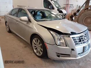 2015 Cadillac XTS Luxury z VIN 2G61M5S37F9160245, wystawiony jako IAAI lot #41696259 z przebiegiem 132 957 mil mil oraz . Historia ofert i sprzedaży dostępna na DreamBid. Obrazek 1.