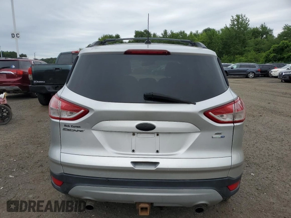 2013 Ford Escape SE z VIN 1FMCU9G9XDUC40645, wystawiony jako Copart lot #62681275 z przebiegiem 117 744 mil mil oraz Czysty tytuł • Clean title. Historia ofert i sprzedaży dostępna na DreamBid. Obrazek 6.