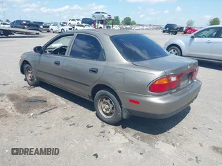 1997 Mazda Protege DX with VIN JM1BC1416V0132633, listed as a IAAI auction lot 42162630 with 234,300 mi miles and . Bid and sale history available at DreamBid. Image 3.
