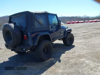 2003 Jeep Wrangler Sport with VIN 1J4FA49S03P343285, listed as a IAAI auction lot 41823684 with 201,723 mi miles and . Bid and sale history available at DreamBid. Image 4.