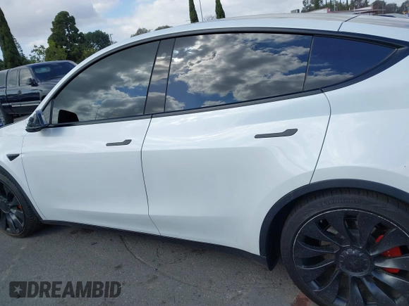 2022 Tesla Model Y Performance with VIN 7SAYGDEF1NF559572, listed as a IAAI auction lot 41516070 with 43,240 mi miles and . Bid and sale history available at DreamBid. Image 13.