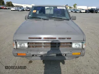 1989 Nissan Hardbody z VIN 1N6ND16S2KC377484, wystawiony jako Copart lot #65412324 z przebiegiem 31 573 mil mil oraz Szkody całkowita. Historia ofert i sprzedaży dostępna na DreamBid. Obrazek 5.