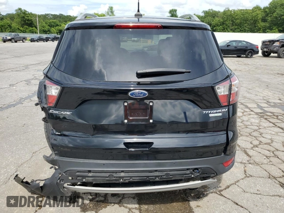 2018 Ford Escape Titanium with VIN 1FMCU0J92JUC84901, listed as a Copart auction lot 60428635 with 69,210 mi miles and Salvage title. Bid and sale history available at DreamBid. Image 6.