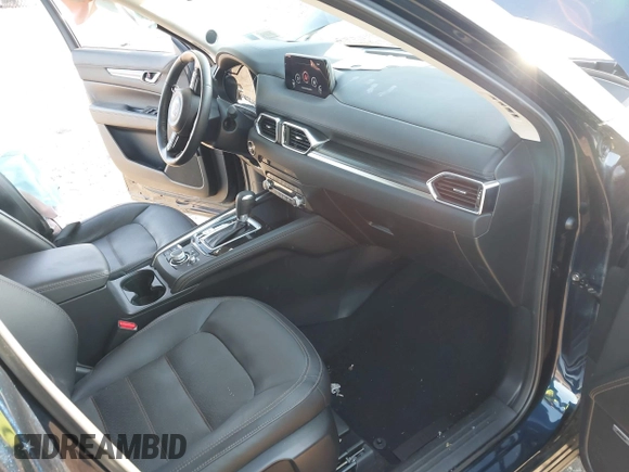 2020 Mazda CX-5 Grand Touring with VIN JM3KFBDM4L0779284, listed as a IAAI auction lot 42060936 with 9,227 mi miles. Bid and sale history available at carsss.com. Image 5.