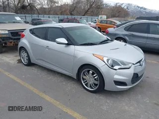 2013 Hyundai Veloster w/Black Int with VIN KMHTC6AD6DU115494, listed as a IAAI auction lot 41821856 with 121,115 mi miles and . Bid and sale history available at DreamBid. Image 1.