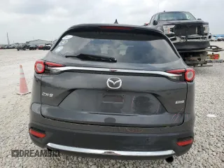2019 Mazda CX-9 Grand Touring z VIN JM3TCADY9K0300284, wystawiony jako Copart lot #51801365 z przebiegiem 53 550 mil mil oraz Szkoda całkowita • Salvage title. Historia ofert i sprzedaży dostępna na DreamBid. Obrazek 6.