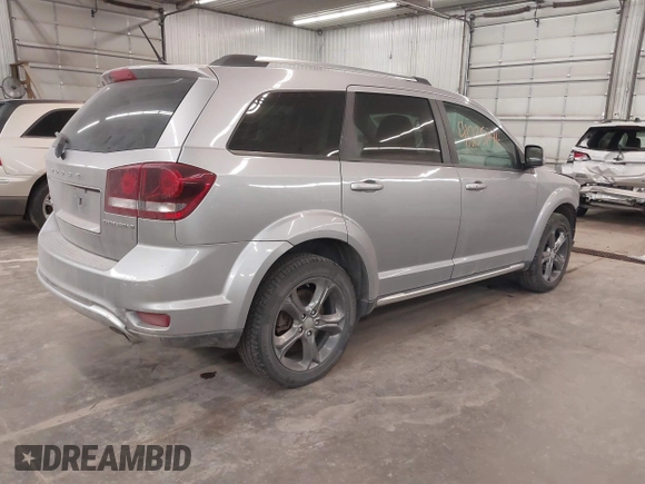 2015 Dodge Journey Crossroad with VIN 3C4PDCGG8FT631064, listed as a IAAI auction lot 41235846 with 127,718 mi miles and . Bid and sale history available at DreamBid. Image 4.