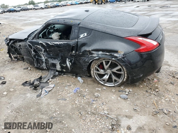 2014 Nissan 370Z Nismo z VIN JN1AZ4EH0EM634461, wystawiony jako Copart lot #53375685 z przebiegiem 171 858 mil mil oraz Szkoda całkowita • Salvage title. Historia ofert i sprzedaży dostępna na DreamBid. Obrazek 2.