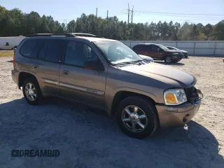 2002 GMC Envoy SLT with VIN 1GKDT13S022456264, listed as a Copart auction lot 76556004 with 230,954 mi miles and Salvage Title. Bid and sale history available at DreamBid. Image 4.