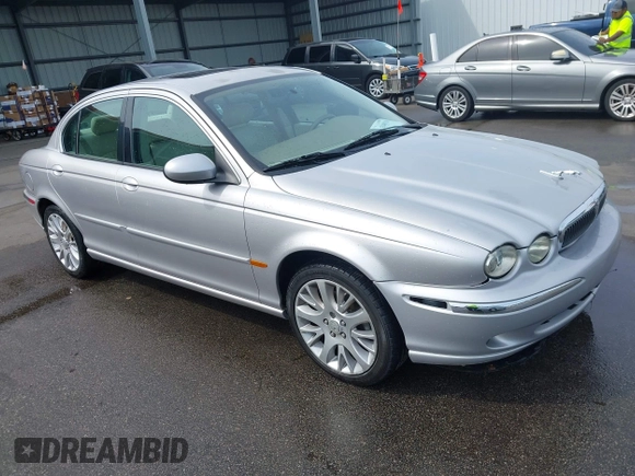 2003 Jaguar X-Type 2.5L Manual with VIN SAJEA51D33XC93300, listed as a IAAI auction lot 42048118 with 116,939 mi miles and . Bid and sale history available at DreamBid. Image 1.