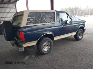 1993 Ford Bronco XL with VIN 1FMEU15N1PLB29714, listed as a IAAI auction lot 41984437 with 165,195 mi miles. Bid and sale history available at carsss.com. Image 4.
