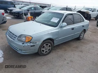 2005 Hyundai Accent GLS with VIN KMHCG45C65U576092, listed as a IAAI auction lot 41368504 with 162,208 mi miles. Bid and sale history available at carsss.com. Image 2.
