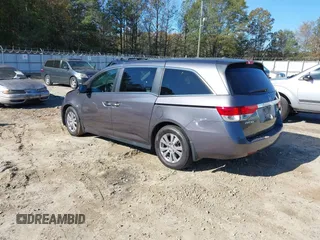 2016 Honda Odyssey EX-L with VIN 5FNRL5H69GB047902, listed as a IAAI auction lot 40795564 with 124,788 mi miles. Bid and sale history available at carsss.com. Image 3.