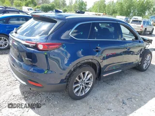 2021 Mazda CX-9 Grand Touring with VIN JM3TCBDY4M0513099, listed as a IAAI auction lot 42563530 with 76,006 mi miles and . Bid and sale history available at DreamBid. Image 4.