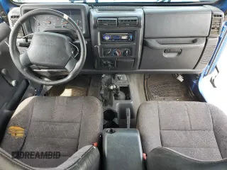 2002 Jeep Wrangler Sport with VIN 1J4FA49S32P762794, listed as a Copart auction lot 52132955 with 243,499 mi miles and Salvage Title. Bid and sale history available at carsss.com. Image 8.