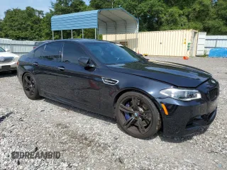 2016 BMW M5 z VIN WBSFV9C55GD595799, wystawiony jako Copart lot #65708864 z przebiegiem 104 198 mil mil oraz Szkoda całkowita • Salvage title. Historia ofert i sprzedaży dostępna na DreamBid. Obrazek 4.