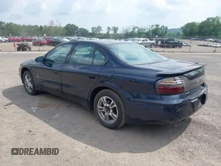 2002 Pontiac Bonneville SLE z VIN 1G2HY54K524175736, wystawiony jako IAAI lot #42730873 z przebiegiem 115 308 mil mil oraz . Historia ofert i sprzedaży dostępna na DreamBid. Obrazek 3.