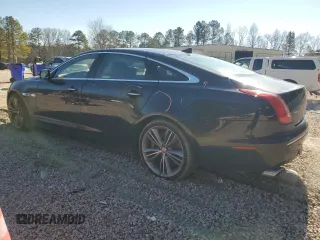2015 Jaguar XJ with VIN SAJWA2GT8FMV83276, listed as a Copart auction lot 86521754 with 105,010 mi miles and Salvage Title. Bid and sale history available at DreamBid. Image 2.