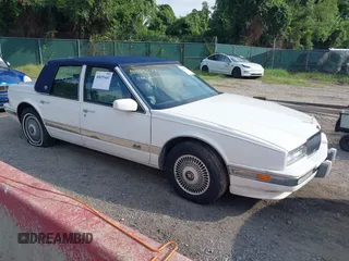 1991 Cadillac Seville z VIN 1G6KS53B9MU820155, wystawiony jako IAAI lot #40035441 z przebiegiem 78 021 mil mil oraz . Historia ofert i sprzedaży dostępna na DreamBid. Obrazek 1.