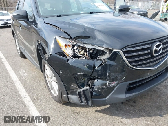 2016 Mazda CX-5 Sport with VIN JM3KE4BY7G0893578, listed as a IAAI auction lot 41853840 with 95,937 mi miles. Bid and sale history available at carsss.com. Image 6.