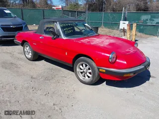 1989 Alfa Romeo Spider Graduate with VIN ZARBA5641K1063527, listed as a IAAI auction lot 41884427 with 107,243 mi miles. Bid and sale history available at carsss.com. Image 1.