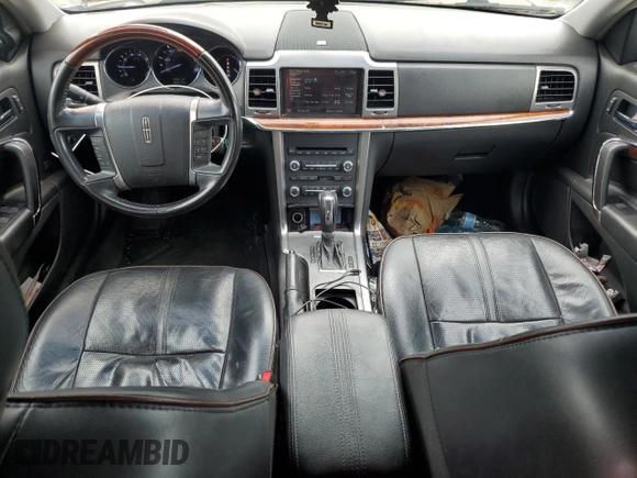 2012 Lincoln MKZ with VIN 3LNHL2JC1CR808663, listed as a Copart auction lot 61001675 with 153,627 mi miles and Salvage title. Bid and sale history available at DreamBid. Image 8.