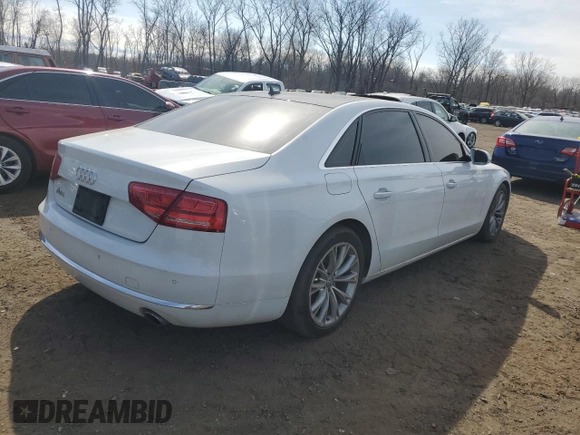 2014 Audi A8 3.0T z VIN WAURGAFD5EN007438, wystawiony jako Copart lot #47979945 z przebiegiem 147 236 mil mil oraz Szkody całkowita. Historia ofert i sprzedaży dostępna na DreamBid. Obrazek 3.