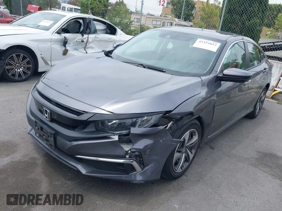2020 Honda Civic LX z VIN 2HGFC2F60LH596396, wystawiony jako IAAI lot #42354812 z przebiegiem 62 082 mil mil oraz . Historia ofert i sprzedaży dostępna na DreamBid. Obrazek 2.