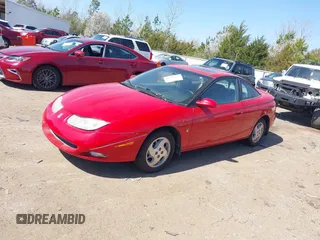 2002 Saturn SC with VIN 1G8ZY12792Z127824, listed as a IAAI auction lot 41760132 with 80,908 mi miles. Bid and sale history available at carsss.com. Image 2.