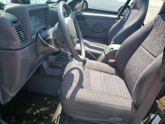 2002 Jeep Wrangler Sport with VIN 1J4FA49S02P721457, listed as a Copart auction lot 61726855 with 76,191 mi miles and Salvage title. Bid and sale history available at DreamBid. Image 7.