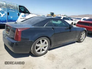 2004 Cadillac XLR z VIN 1G6YV34A345603061, wystawiony jako Copart lot #67412674 z przebiegiem 88 335 mil mil oraz Szkody całkowita. Historia ofert i sprzedaży dostępna na DreamBid. Obrazek 3.