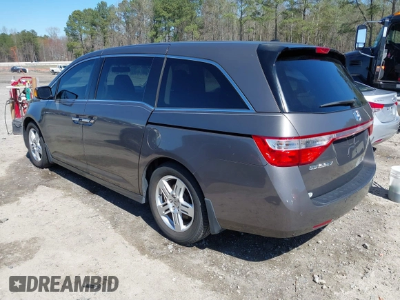 2012 Honda Odyssey Touring with VIN 5FNRL5H91CB057344, listed as a IAAI auction lot 41835272 with 158,854 mi miles. Bid and sale history available at carsss.com. Image 3.