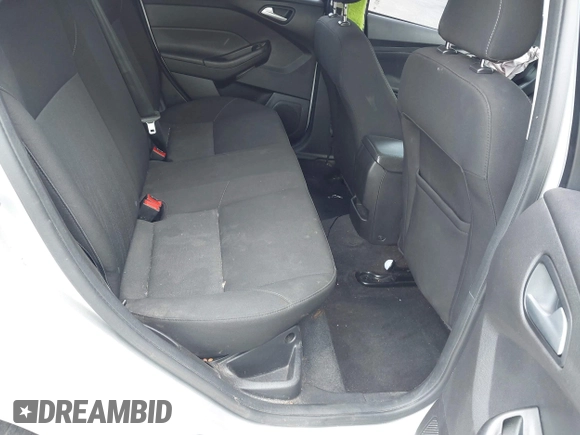 2018 Ford Focus SE z VIN 1FADP3FE9JL241661, wystawiony jako IAAI lot #42103513 z przebiegiem 117 003 mil mil oraz . Historia ofert i sprzedaży dostępna na DreamBid. Obrazek 8.