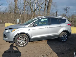 2015 Ford Escape Titanium z VIN 1FMCU0J91FUC41531, wystawiony jako IAAI lot #41903203 z przebiegiem 118 962 mil mil oraz . Historia ofert i sprzedaży dostępna na DreamBid. Obrazek 14.