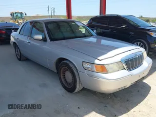2001 Mercury Grand Marquis LS z VIN 2MEFM75W91X660964, wystawiony jako IAAI lot #42250931 z przebiegiem 74 462 mil mil oraz . Historia ofert i sprzedaży dostępna na DreamBid. Obrazek 1.